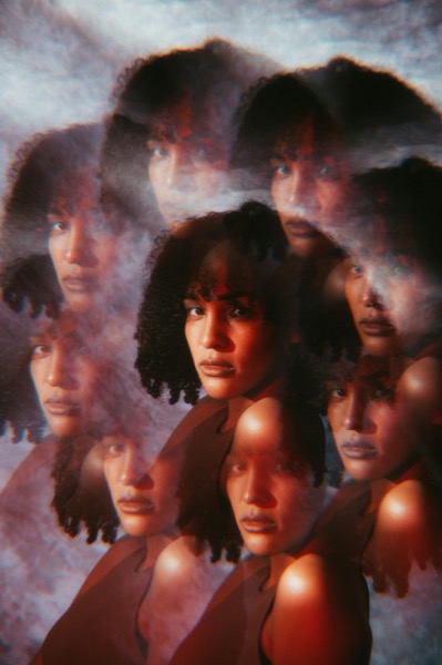Overlapping translucent faces in warm tones